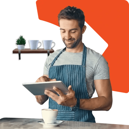 Man using a tablet in an apron